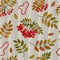 Seamless pattern with autumn bunches of rowan berries on a sprig with leaves and rowan beads