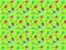 Seamless pattern from baby rattles toys on a light green background. Idea for fabric.