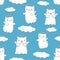 Seamless pattern background with clouds, cartoon cats pictured as a little angels with wings and halo in japanese kawaii