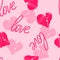 Seamless pattern background with hand-drawing hearts and love word for use in design for valentines day or wedding