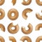 Seamless pattern of bites taken off a donut