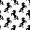 Seamless pattern with black horses.