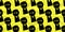 Seamless pattern of black silhouette rised fist in the air isolated on yellow background.