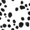 Seamless pattern of black and white Dalmatian skin with many random spots and realistic blank space around.