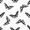 Seamless pattern with black and white rajah brooke`s birdwing