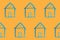 Seamless pattern with blue house icon on orange backboard. Cartoon style baby illustration. Architecture, construction