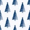 Seamless pattern with blue pen hand drawn fir trees on a checkered paper.