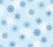 Seamless pattern with blue and wite hand drawn snowflake icons on light blue backdrop. Winter Christmas festive background, snow