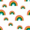 Seamless pattern with bright rainbows on a white background