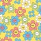 Seamless pattern with bright smiling flowers. Vector graphics
