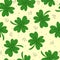 Seamless pattern with cartoon clover, decor elements on a neutral background. festive colorful vector for St. Patrick`s Day. Hand