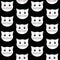 Seamless pattern with cats. Kittens on a black background.