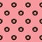 Seamless Pattern Of Chocolate Donuts On Pastel Pink Background