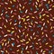 Seamless pattern chocolate glaze for donut. Brown background with decorative colored sprinkles. Vector.