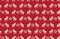 Seamless pattern of Christmas reindeer pixel art on a red background