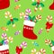 Seamless pattern with Christmas socks, candy cane, candy, wreath of holly