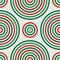 Seamless pattern in Christmas traditional colors with round vortexes. Repeated circles ornamental wallpaper