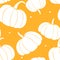 Seamless pattern with cinderella pumpkins. White silhouette on orange backdrop