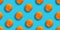 Seamless pattern of citrus fruit - orange, on blue background. Fresh repeating orange fruit on blue background