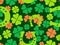 Seamless pattern with clover leaves and horseshoes for St. Patrick\\\'s Day. Clover leaves and a horseshoe