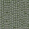 Seamless pattern of cobblestone street paving with grass.