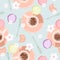 Seamless pattern with coffee, macarons, and flowers. Morning background. Vector