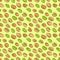 Seamless pattern with colored flat realistic pistachios nuts on green background. Salty delicious organic food nutshells, peeled.