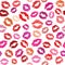 Seamless pattern with colored lipstick kisses. Imprints of lips