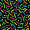 Seamless pattern of colored sprinkles in on the black background