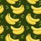 Seamless pattern, colorful bananas and leaves on a green background. Fruit background, print, textile