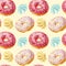 Seamless pattern with colorful donuts with glaze and sprinkles.