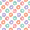 Seamless pattern with colorful donuts on a white background.