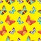 Seamless pattern of colorful embroidered butterflies on a yellow