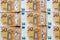 Seamless pattern with colorful fifty euro bills