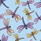 Seamless pattern of colorful flying dragonflies