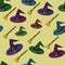 Seamless pattern with colorful hats and broomsticks on light yellow background. Witchcraft. Wizard print. halloween design. Packag