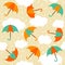 Seamless pattern with colorful umbrellas on yellow autumn  rainy background