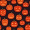 Seamless pattern of creepy pumpkins on a dark background. Halloween background. Vector illustration in cartoon