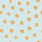 Seamless pattern with cute citrus letters. Cartoon alphabet carved from slices of orange with white highlights isolated on blue-