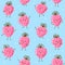 Seamless pattern with cute happy strawberries on blue