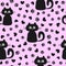 Seamless pattern with cute kittens and silhouettes of hearts and cat`s paws.