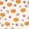 Seamless pattern with cute little tiger and footprints