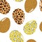 Seamless pattern with cute painted eggs in a predatory leopard design on a white background