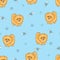 Seamless pattern with cute pomeranian puppy on blue.