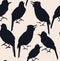 Seamless pattern of dark silhouettes of tropical bird on a light pink background