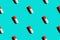 Seamless pattern diagonal rows of white and red pills in capsules with drop shadow on blue background. Healthcare