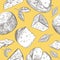 Seamless pattern with different varieties of cheese. Yellow background.