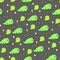 seamless pattern of dinosaurs and skulls on gray background