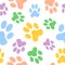 Seamless pattern with doodle dog paws. Colorful animal print.
