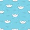 Seamless pattern with doodle paper boats on blue
